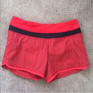 Red and black lululemon running shorts